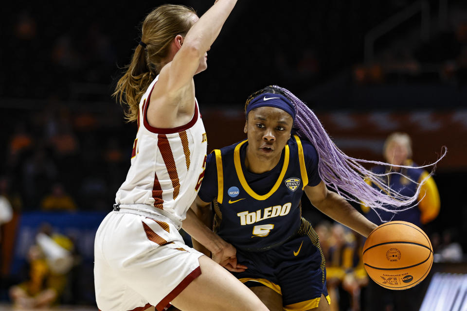 Toledo guard Quinesha Lockett (5) drives against Iowa State guard Lexi Donarski (21) in the first half of a first-round college basketball game in the NCAA Tournament, Saturday, March 18, 2023, in Knoxville, Tenn. (AP Photo/Wade Payne)