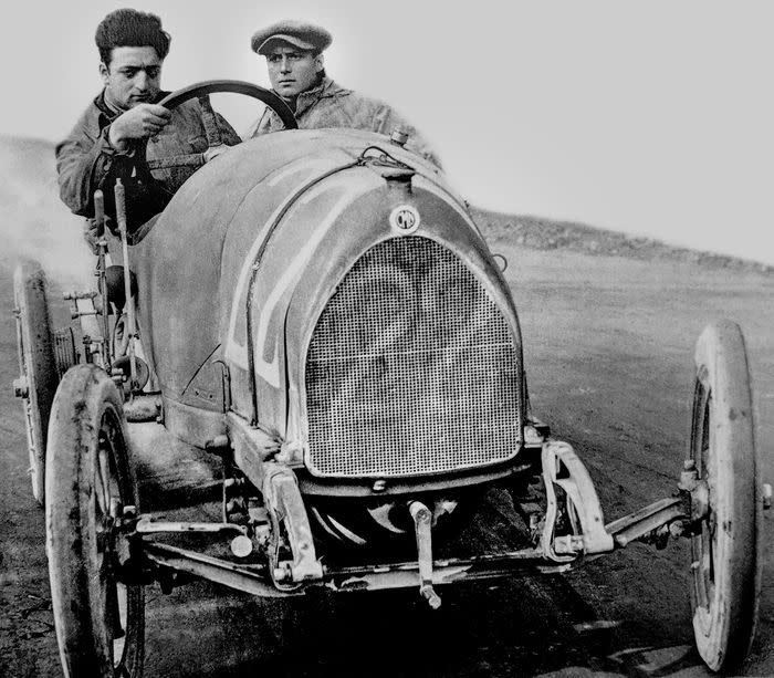 enzo ferrari in a cmn race car