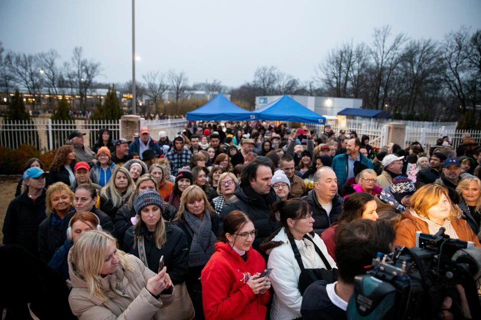 Mourners gather across the street from Graceland prior to being allowed onto the front lawn at 7 a.m. for the celebration of life for Lisa Marie Presley in Memphis, Tenn., on Sunday, January 22, 2023. 