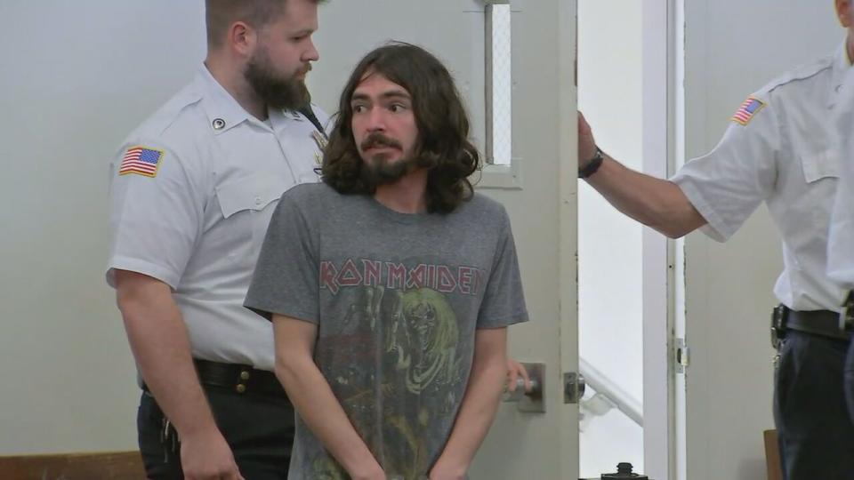 Justin Moreira appears in a Cape Cod courtroom charged with making 