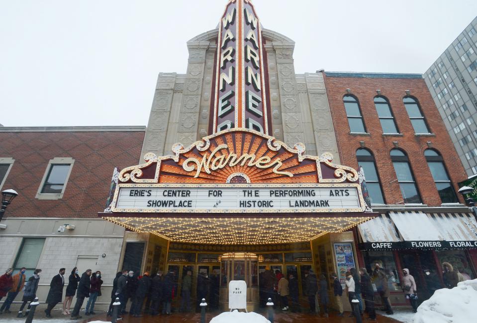 Patrons wait to go inside the Warner Theatre on Jan. 23, 2022, in Erie.