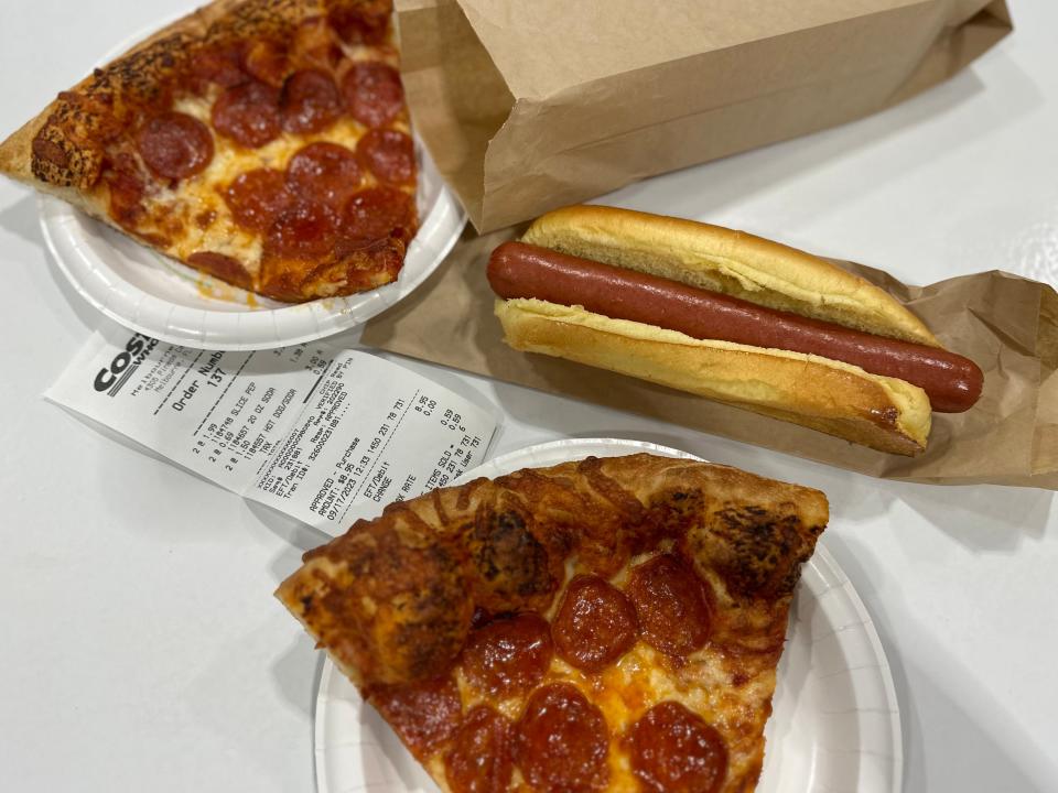 Two slices of pepperoni pizza and a hot dog from Costco food court