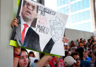 <p>Protesters hold signs at a rally for gun control at the Broward County Federal Courthouse in Fort Lauderdale, Fla., on Feb. 17, 2018. (Photo: Rhona Wise/AFP/Getty Images) </p>