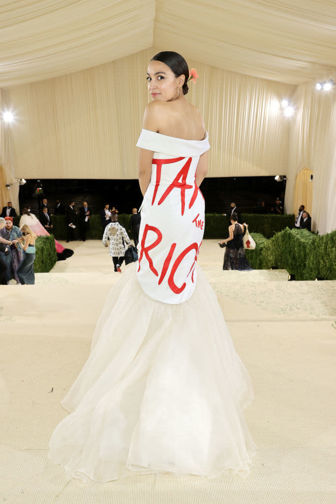 The back of Alexandria's dress says "tax the rich" in large letters