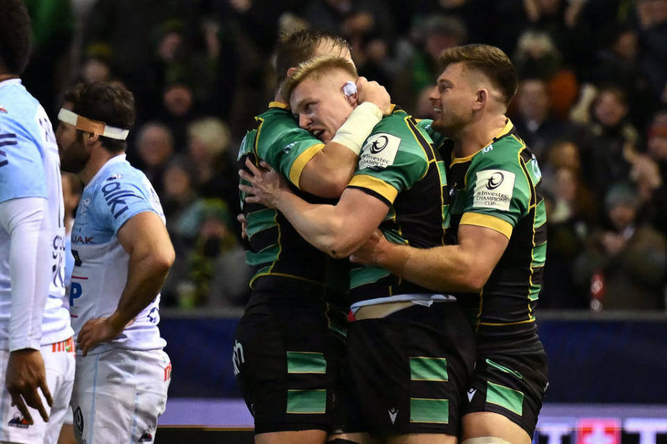 Northampton Saints' English flanker Tom Pearson (C) celebrates with teammates after scoring a try during the European Rugby Champions Cup Pool 3 rugby union match between Northampton Saints and Aviron Bayonnais (Bayonne) at Franklin's Gardens in Northampton, central England on January 12, 2024. (Photo by Ben Stansall / AFP) (Photo by BEN STANSALL/AFP via Getty Images)
