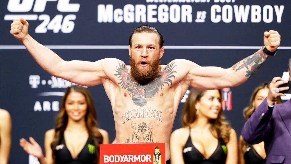 Conor McGregor poses for a weigh-in at the UFC.