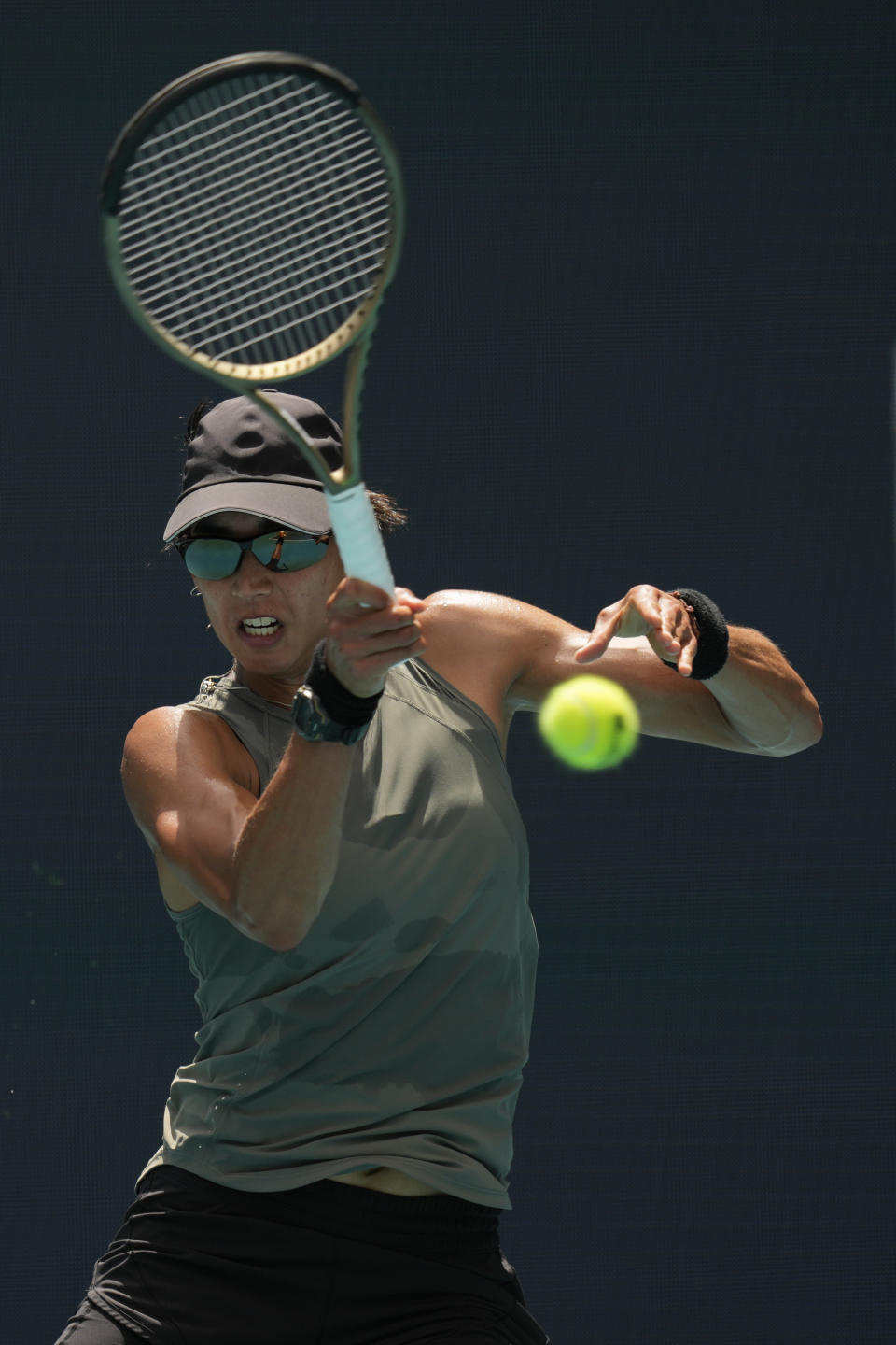 Astra Sharma of Australia returns a ball in her first round women's match against Naomi Osaka of Japan, at the Miami Open tennis tournament, Wednesday, March 23, 2022, in Miami Gardens, Fla. (AP Photo/Rebecca Blackwell)