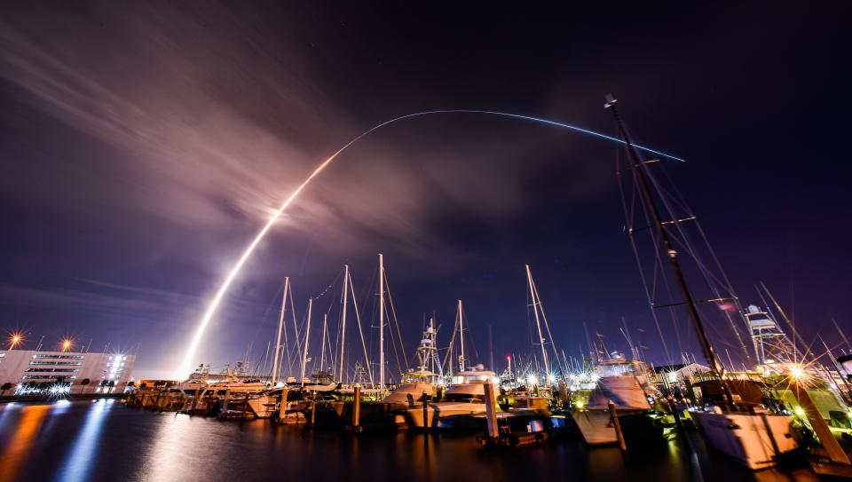 United Launch Alliance's next-generation Vulcan rocket streaks across the darkened Space Coast sky on its 2:18 a.m. Monday maiden flight, as seen from a Port Canaveral marina.
