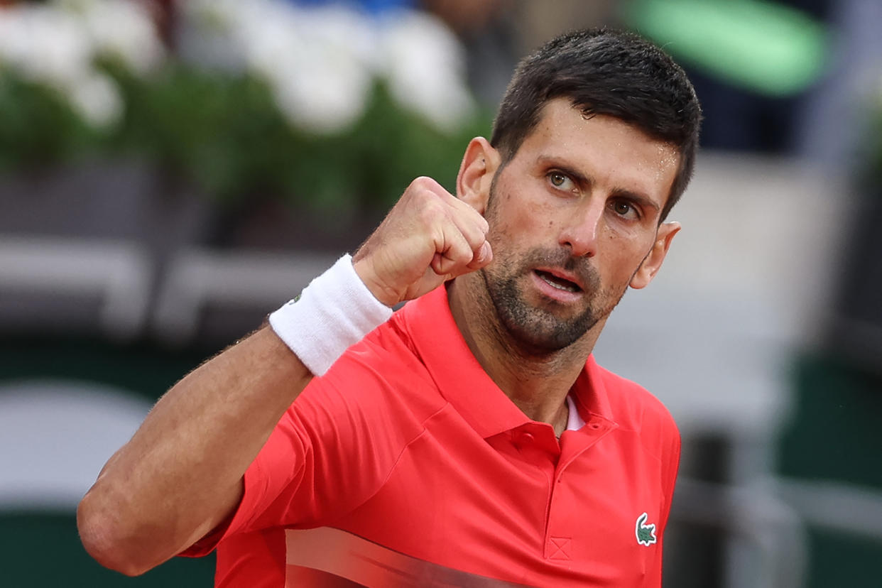 Serbia's Novak Djokovic celebrates after winning against Slovakia's Alex Molcan at the end of their men's singles match on day four of the Roland-Garros Open tennis tournament at the Court Suzanne-Lenglen in Paris on May 25, 2022. (Photo by Thomas SAMSON / AFP) (Photo by THOMAS SAMSON/AFP via Getty Images)