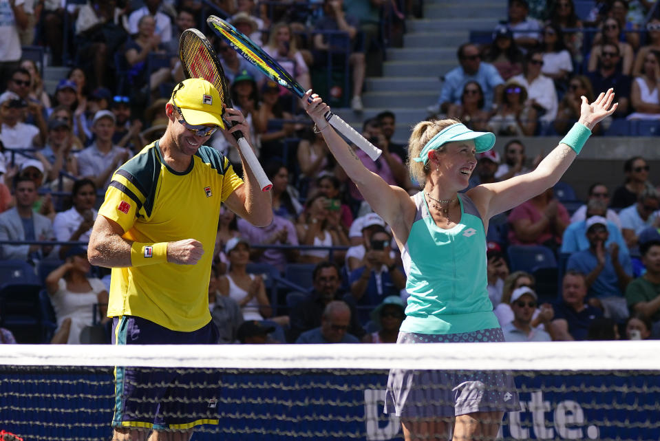 John Peers, left, and Storm Sanders, of Australia, react after winning the mixed doubles final against Kirsten Flipkens, of Belgium, and Edouard Roger-Vasselin, of France, at the U.S. Open tennis championships, Saturday, Sept. 10, 2022, in New York. (AP Photo/Matt Rourke)