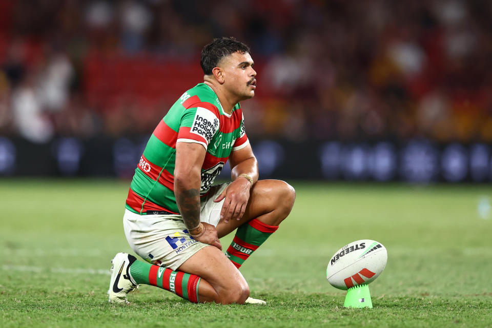 Latrell Mitchell prepares to kick.