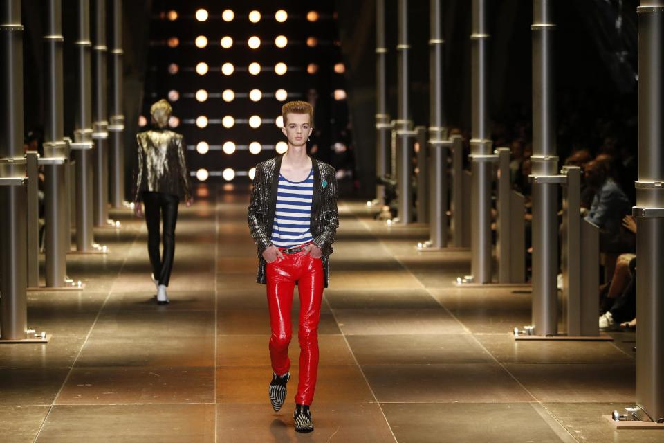 A model presents a creation as part of Yves Saint Laurent men's fashion Spring-Summer 2014 collection, presented Sunday, June 30, 2013 in Paris. (AP Photo/Francois Mori)