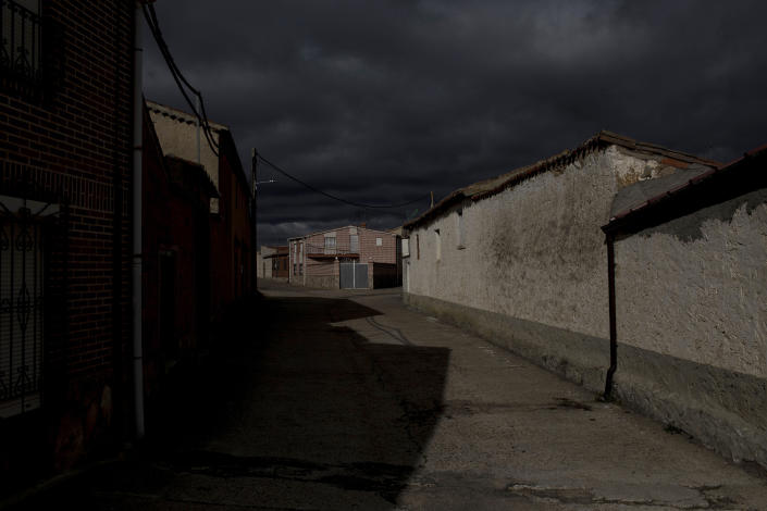 Clouds loom over Riego del Camino, in the Zamora province of Spain, on Sunday, Nov. 28, 2021. The province has lost 16% of its population since 2000. (AP Photo/Manu Brabo)