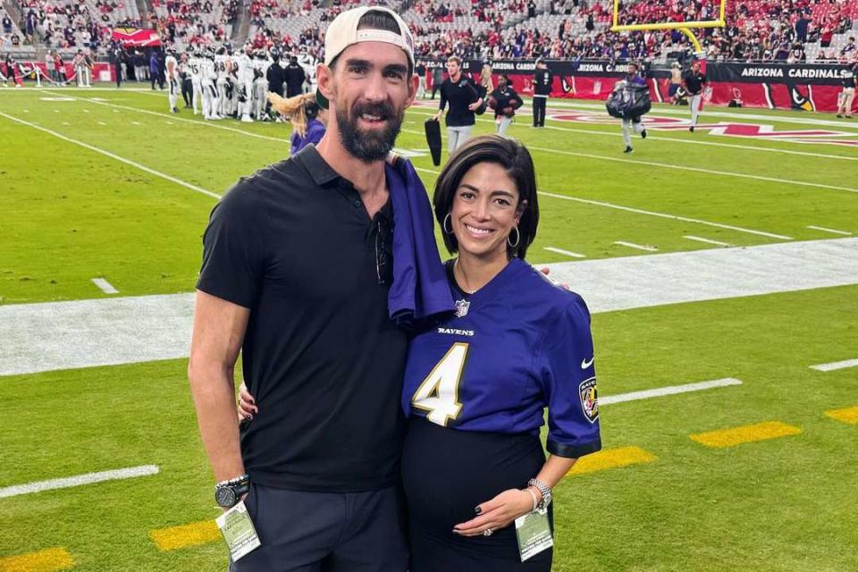 <p>Nicole Phelps/Instagram</p> Michael Phelps and Nicole Johnson pose for an Instagram photo during an NFL game