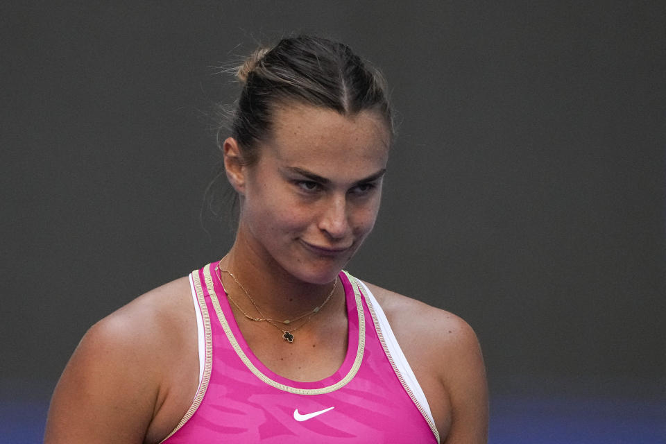 Aryna Sabalenka of Belarus reacts during the first round of the China Open tennis tournament Sofia Kenin, of the United States, at the Diamond Court in Beijing, Sunday, Oct. 1, 2023. (AP Photo/Andy Wong)