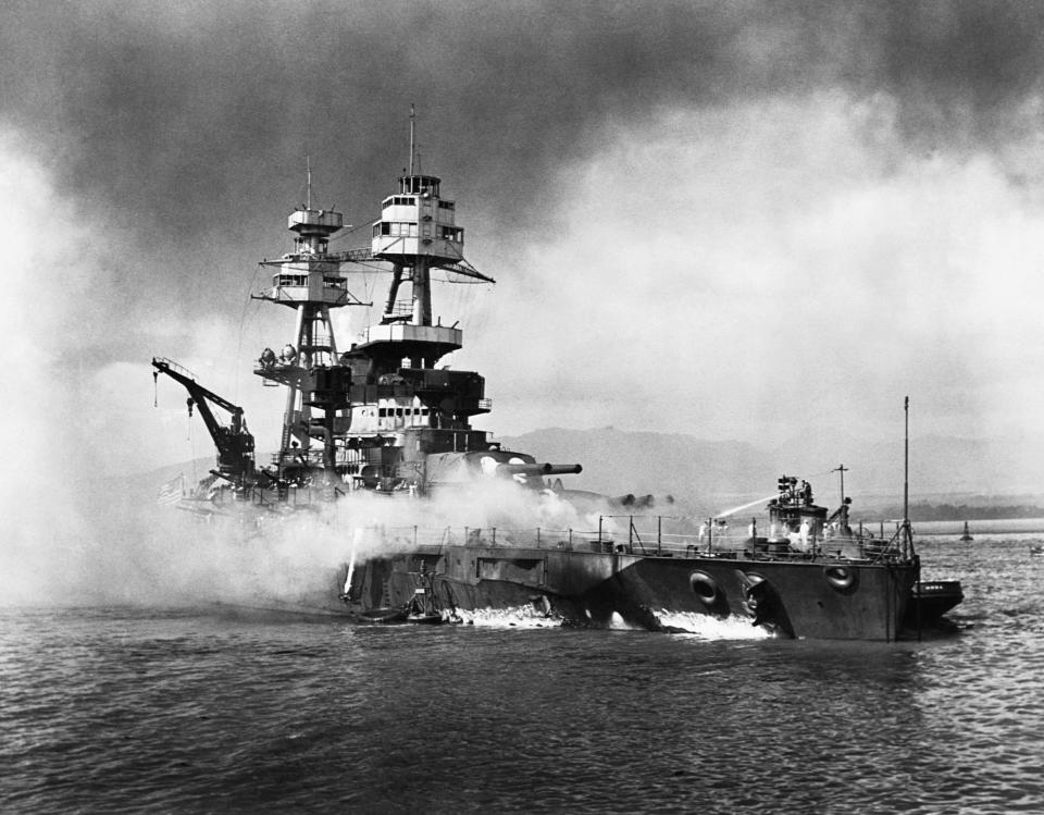 The USS Nevada burns following the surprise attack on Pearl Harbor by the Japanese military.