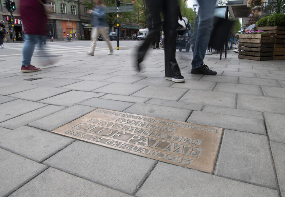 The memorial plaque in Stockholm, Sweden Monday June 8, 2020 shows the place where Swedish Prime Minister Olof Palme was shot dead in February 1986. Swedish prosecutors will announce Wednesday June 10, 2020 a decision in the investigation into the long unsolved murder of former Swedish Prime Minister Olof Palme, who was shot dead in downtown Stockholm in 1986. (Fredrik Sandberg/TT via AP)