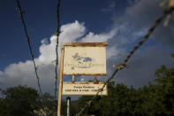 FILE - This Thursday, Oct. 21, 2021 photo shows a sign outside Christian Aid Ministries in Titanyen, Haiti, which had 17 of their members kidnapped. A joint statement by the hostages’ families said “God has given our loved ones the unique opportunity to live out our Lord’s command to, 'love your enemies, bless them that curse you, do good to them that hate you.'” (AP Photo/Matias Delacroix)