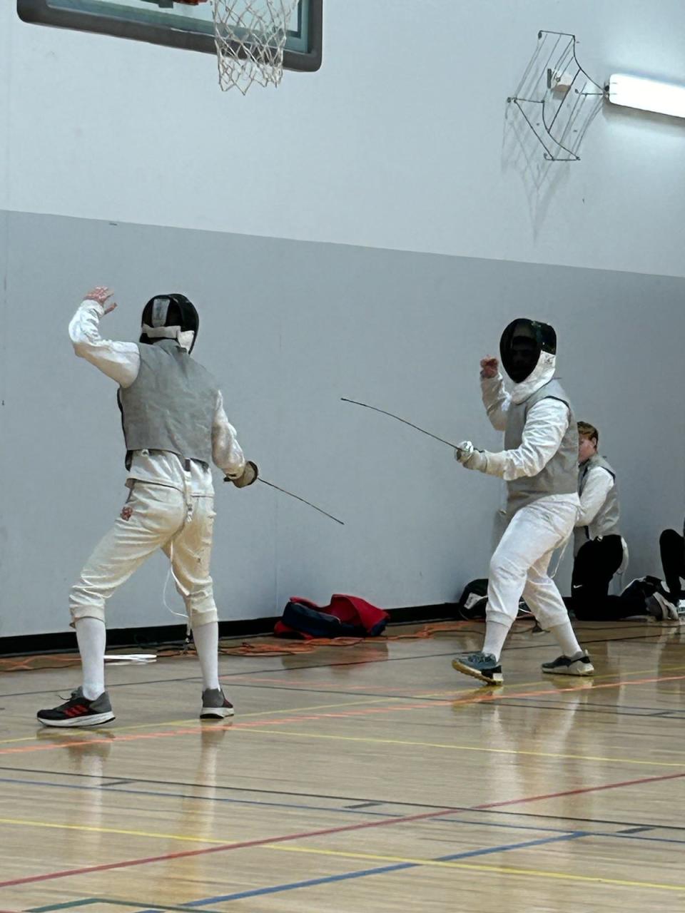 Reisman Berg, left, faces Jeremiah Levis in a fencing match. Berg and Levis are both part of the Cornerstone Classical School fencing program, which brought the sport back to Salina after a nearly decade-long absence in the community.