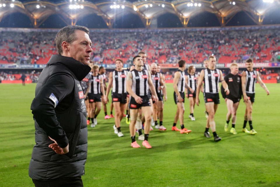 GOLD COAST, AUSTRALIA - JUNE 29: Craig McRae, Senior Coach of the Magpies looks on as Collingwood leave the field during the 2024 AFL Round 16 match between the Gold Coast SUNS and the Collingwood Magpies at People First Stadium on June 29, 2024 in Gold Coast, Australia. (Photo by Russell Freeman/AFL Photos via Getty Images)