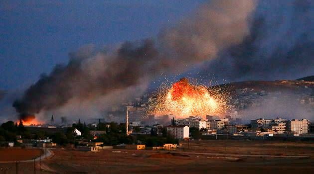 Smoke and flames rise over Syrian town of Kobani after an airstrike, as seen from the Mursitpinar crossing on the Turkish-Syrian  border in the southeastern town of Suruc in Sanliurfa province on October 20. Photo: Reuters