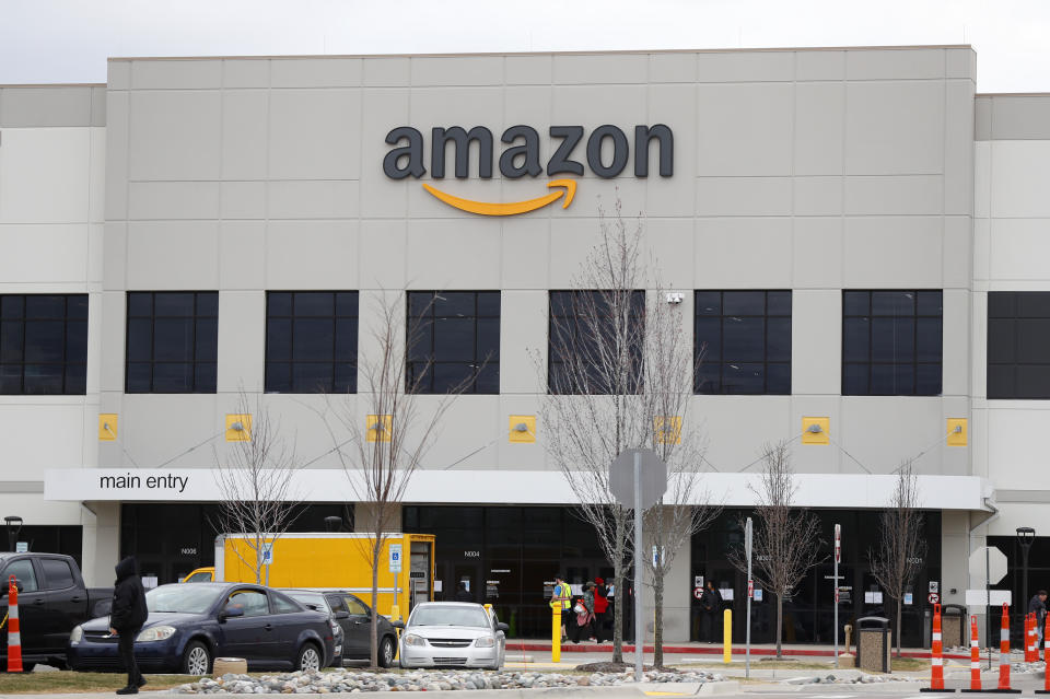 The Amazon DTW1 fulfillment center is shown in Romulus, Mich., Wednesday, April 1, 2020. Employees and family members are protesting in response to what they say is the company's failure to protect the health of its employees amid the new coronavirus COVID-19 outbreak. (AP Photo/Paul Sancya)