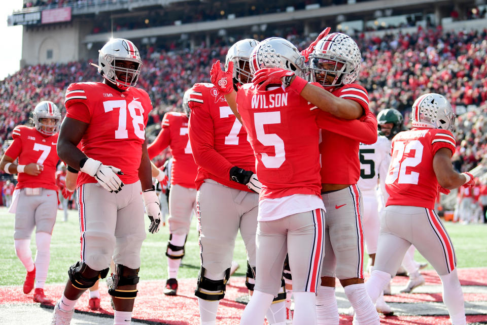 COLUMBUS, OHIO - NOVEMBER 20: Garrett Wilson #5 of the Ohio State Buckeyes celebrates his touchdown with teammates during the first half of a game against the Michigan State Spartans at Ohio Stadium on November 20, 2021 in Columbus, Ohio. (Photo by Emilee Chinn/Getty Images)