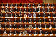 Delegates wearing face masks to protect against the spread of the new coronavirus wait for the start of the opening session of the Chinese People's Political Consultative Conference (CPPCC) at the Great Hall of the People in Beijing, Thursday, May 21, 2020. (AP Photo/Andy Wong, Pool)