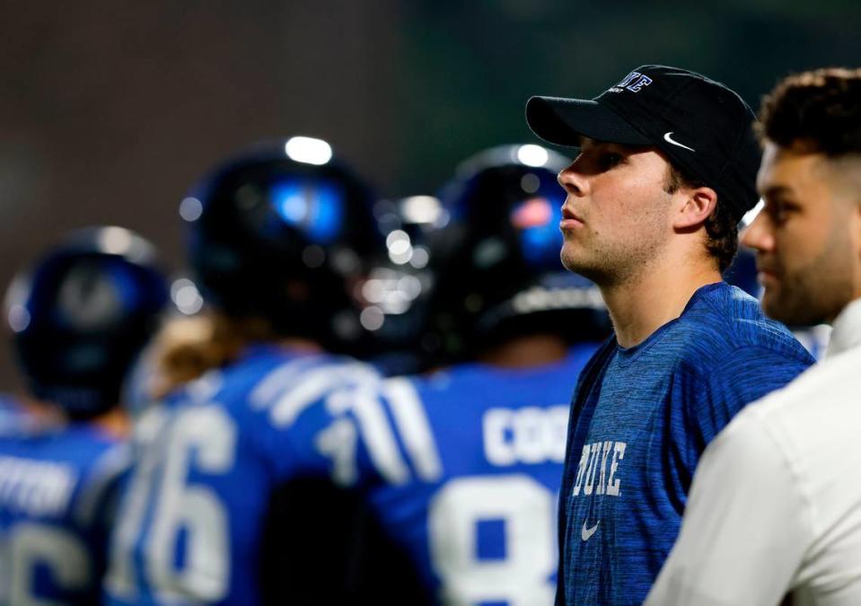 Duke’s Riley Leonard watches from the sidelines during the first half of the Blue Devils’ game against N.C. State on Saturday, Oct. 14, 2023, at Wallace Wade Stadium in Durham, N.C.