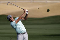 Rickie Fowler follows through on his shot from the ninth fairway during the second round of The American Express golf tournament on the Nicklaus Tournament Course at PGA West on Friday, Jan. 17, 2020, in La Quinta, Calif. (AP Photo/Marcio Jose Sanchez)