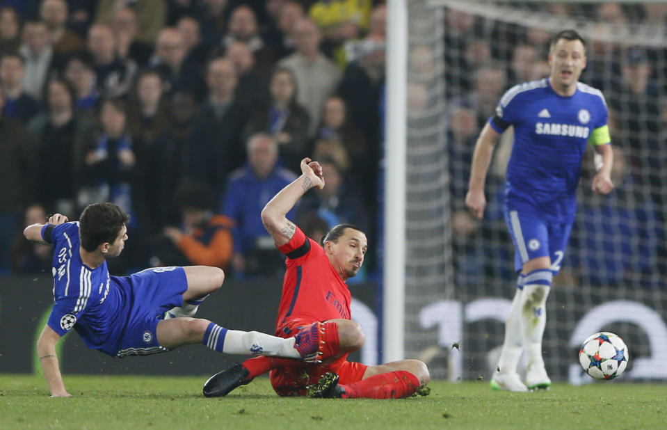 Football - Chelsea v Paris St Germain - UEFA Champions League Second Round Second Leg - Stamford Bridge, London, England - 11/3/15 PSG's Zlatan Ibrahimovic fouls Chelsea's Oscar and is sent off Reuters / Stefan Wermuth Livepic EDITORIAL USE ONLY.