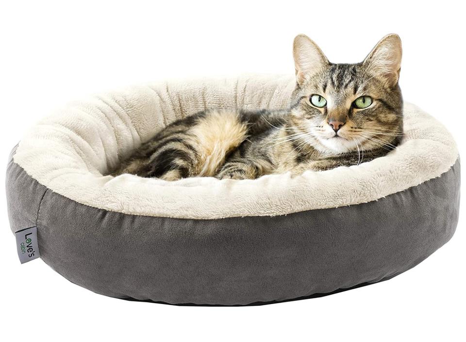 Super soft walls with plush filling make this bed a standout for helping your pet feel safe. (Source: Amazon)