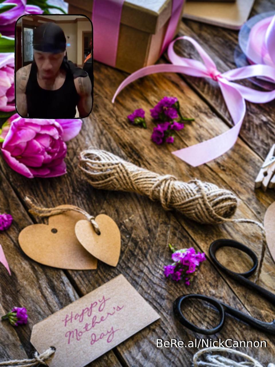 Nick Cannon, crafts spread across a table that say "Happy Mother's Day"