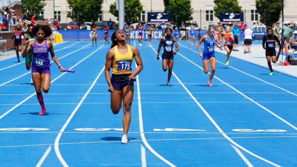 Bryan Station’s Sanaa Washington lets out a yell as she crosses the finish line first for her Defenders team in the girls 4-by-100 meter relay race in the KHSAA Class 3A State Track and Field Meet at the University of Kentucky Outdoor Track and Field Facility on Saturday.