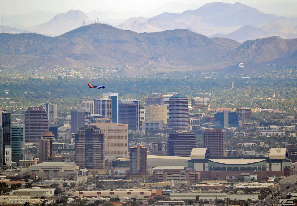 A jet comes in for approach over downtown, in Phoenix, Arizona.