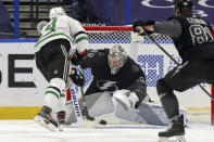 Tampa Bay Lightning goaltender Andrei Vasilevskiy makes a save against Dallas Stars' Jamie Benn during the second period of an NHL hockey game Saturday, Feb. 27, 2021, in Tampa, Fla. (AP Photo/Mike Carlson)