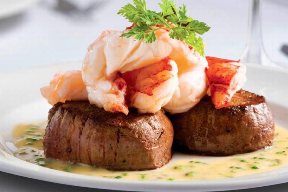 A seared tenderloin with butter-poached lobster tails at The Capital Grille.