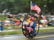 <p>Hoop-mobile rider Keith Dufrane dons patriotic clothing during the DooDah Parade in Columbus, Ohio, Sunday, July 4, 2004. (Photo: Columbus Dispatch, Mike Elicson/AP) </p>