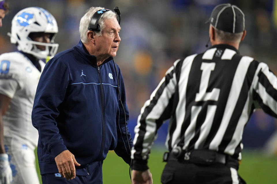 North Carolina head coach Mack Brown, center, looks on during the first half of an NCAA college football game against Pittsburgh in Pittsburgh, Saturday, Sept. 23, 2023. (AP Photo/Gene J. Puskar)