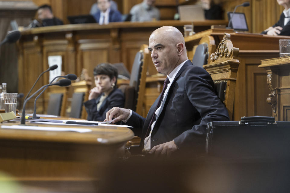 FILE - Swiss Federal President Alain Berset, front, attends an extraordinary session of the Federal Assembly in Bern, Switzerland, on April 11, 2023. On Sunday Oct. 22, 2023 Swiss voters elect the two houses of parliament, an exercise every four years that will ultimately shape the future composition of the Alpine country’s executive branch: The Federal Council. (Alessandro della Valle/Keystone via AP, File)