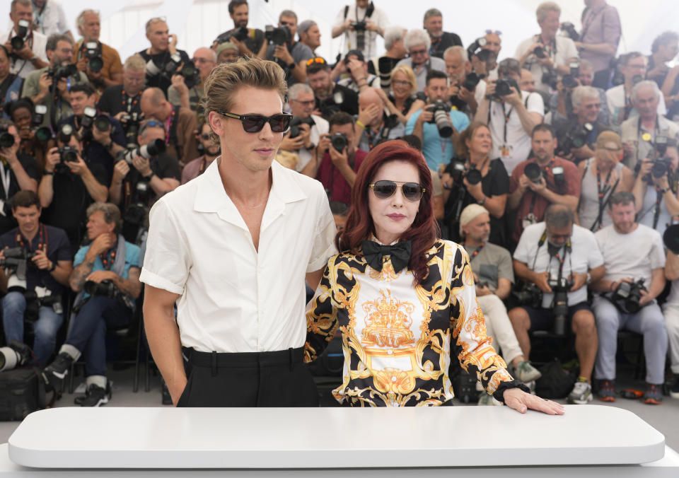 Austin Butler, from left, and Priscilla Presley pose for photographers at the photo call for the film 'Elvis' at the 75th international film festival, Cannes, southern France, Thursday, May 26, 2022. (Photo by Joel C Ryan/Invision/AP)