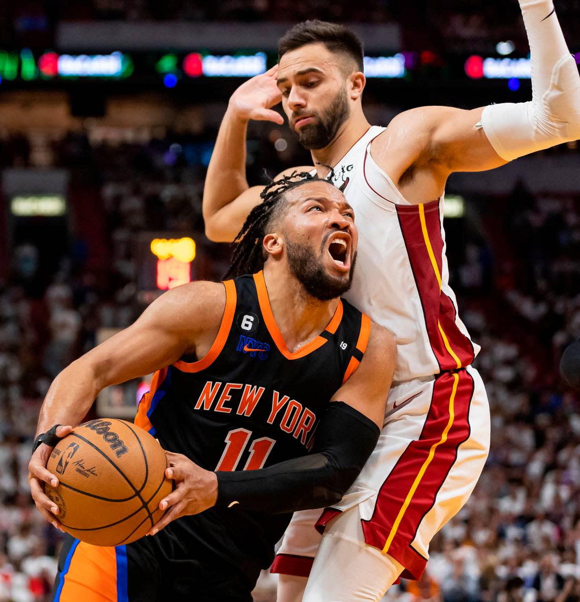 Miami Heat guard Max Strus (31) fouls New York Knicks guard Jalen Brunson (11) in the fourth quarter of Game 4 of the NBA Eastern Conference Semifinals at the Kaseya Center in Miami on Monday, May 8, 2023.