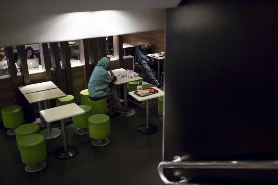 Men sleep at a 24-hour McDonald's restaurant in Hong Kong, China November 11, 2015. A large number of homeless people sleeping on the street has long been been a problem in Hong Kong mainly due to its high rents and soaring property prices. In recent years, the opening of McDonald's 24-hour fast food restaurants all over the city have become popular alternatives for homeless people known as McRefugees or McSleepers to spend the night in a safer and more comfortable way than on the street. McDonaldâ€™s Hong Kong said in a statement that it is accommodating to people staying long in the restaurant for their own respective reasons, while striking a good balance to ensure that customers enjoy their dining experience. REUTERS/Tyrone Siu