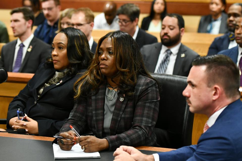 Fulton County District Attorney Fani Willis, left, assistant prosecutor Daysha D. Young, center, and assistant prosecutor Will Wooten listen during a hearing regarding defendant Harrison Floyd (AP)