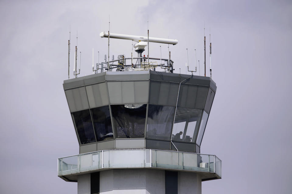 This March 12, 2013 photo shows the air traffic control tower at Chicago's Midway International Airport. Looming federal budget cuts could mean the closure of nearly 240 air traffic control towers at small airports across the country, stripping away an extra layer of safety during takeoffs and landings and leaving many pilots to manage the most critical stages of flight on their own. In addition, overnight shifts could be eliminated at 72 control facilities, including much larger airports such as Midway, which sees an average of 50 overnight flights, nearly all of them operated by Southwest and Delta. (AP Photo/M. Spencer Green)