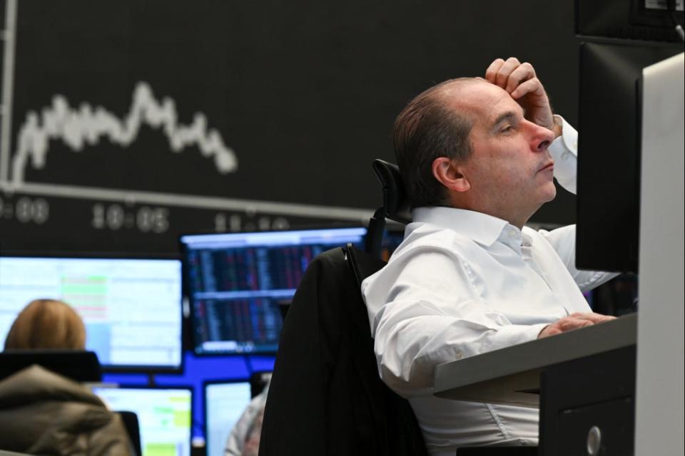 Stock trader Arthur Brunner of ICF Bank AG watches his monitor on the floor of the Frankfurt Stock Exchange (AP)