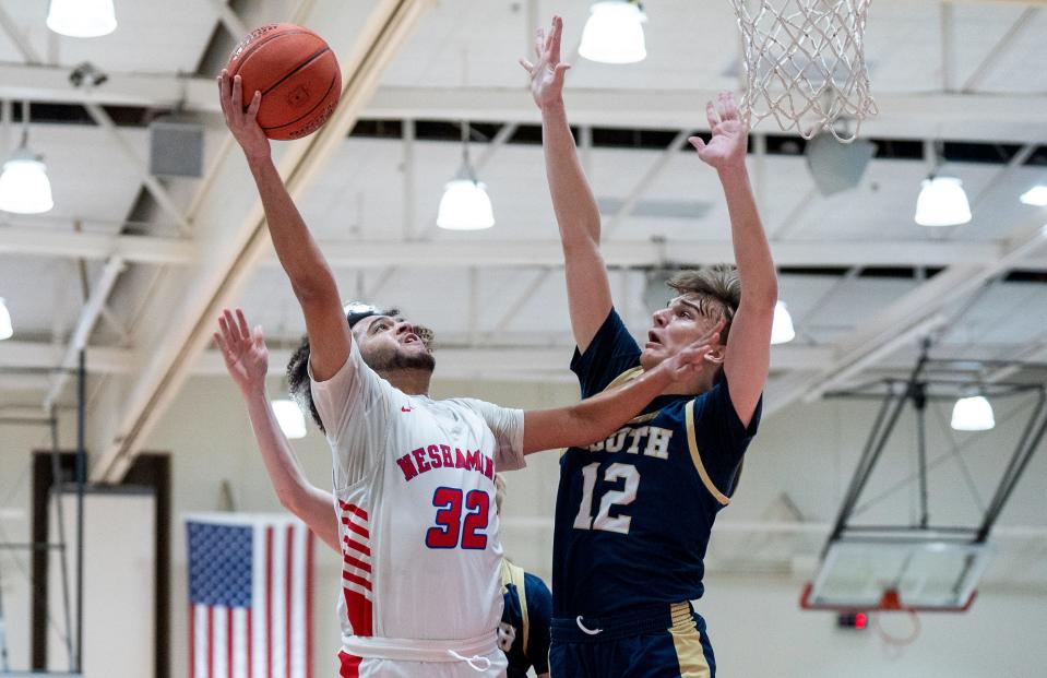 Neshaminy's Nate Townsend (32) drives against Council Rock South's Gabe Cerulli (12) on Jan. 26.