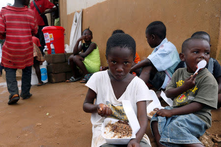 Victims of the mudslide are seen eating at the internally displaced persons camp in Regent, Sierra Leone August 19, 2017. Picture taken August 19, 2017. REUTERS/Afolabi Sotunde