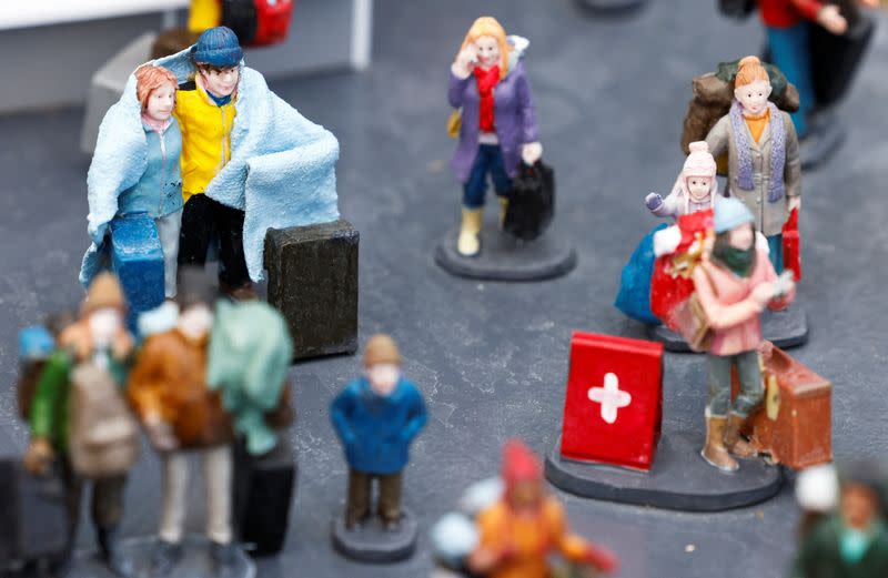 Miniature models depict refugees fleeing Ukraine, at the "Mini-Europe" theme park in Brussels