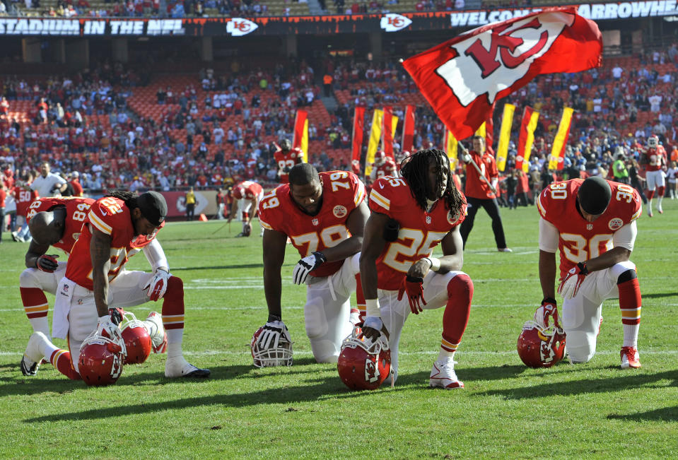 KANSAS CITY, MO - DECEMBER 02: The Kansas City Chiefs kneel and pray before a game against the Carolina Panthers on December 2, 2012 at Arrowhead Stadium in Kansas City, Missouri. (Photo by Peter Aiken/Getty Images)